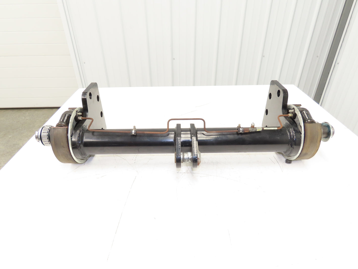 Landoll Front Axle Hub & Brake Assembly Removed From LSC30 Stand On Forklift