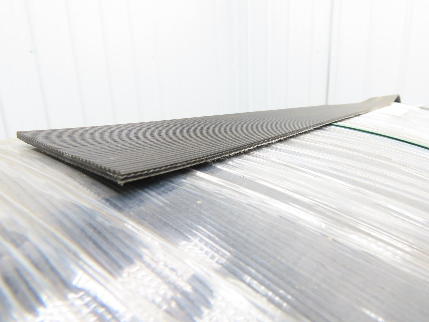 Hytrol 41.5"W x 672' Grooved Rubber Conveyor Belt 2-Ply Black 43"BW