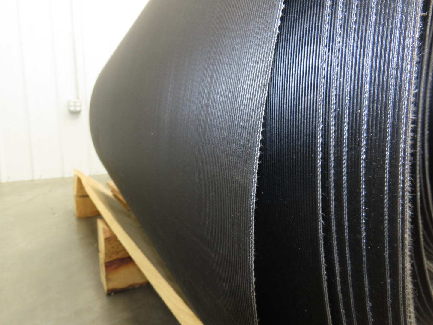 Hytrol 47.5"W x 722' Grooved Rubber Conveyor Belt 2-Ply Black 49"BW