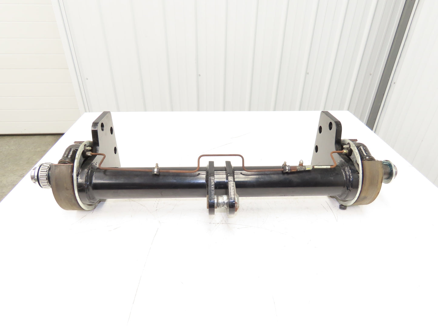 Landoll Front Axle Hub & Brake Assembly Removed From LSC30 Stand On Forklift