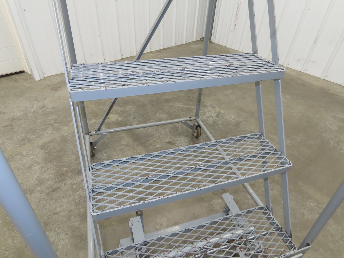 Uline H-84-110 Rolling Ladder 5 Step 10" Work Platform 50" Top Step 450lbs