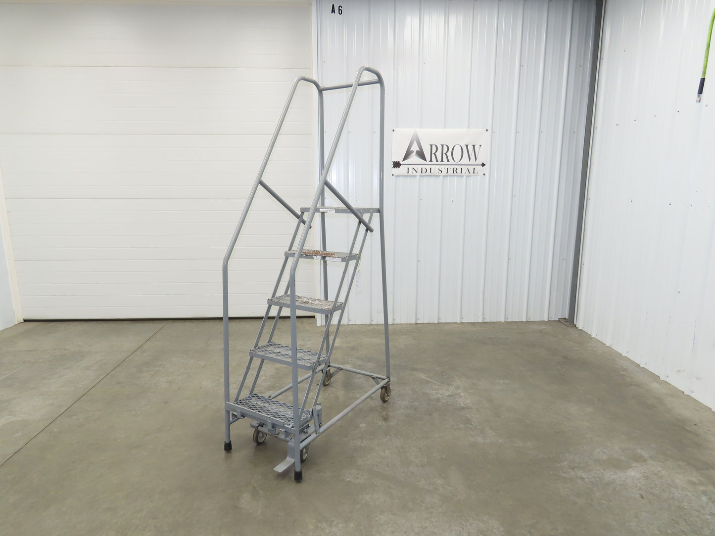 Uline H-5073A-10 Rolling Ladder Narrow Aisle 5 Step 10" Platform 50" Top Step