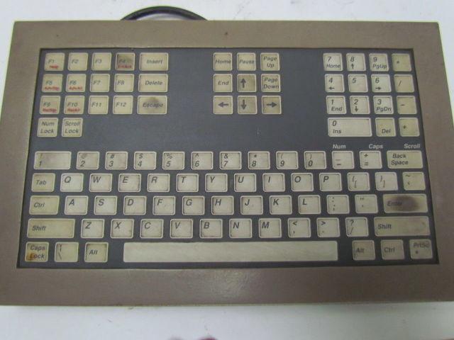 CNC lathe operator control panel computer keyboard